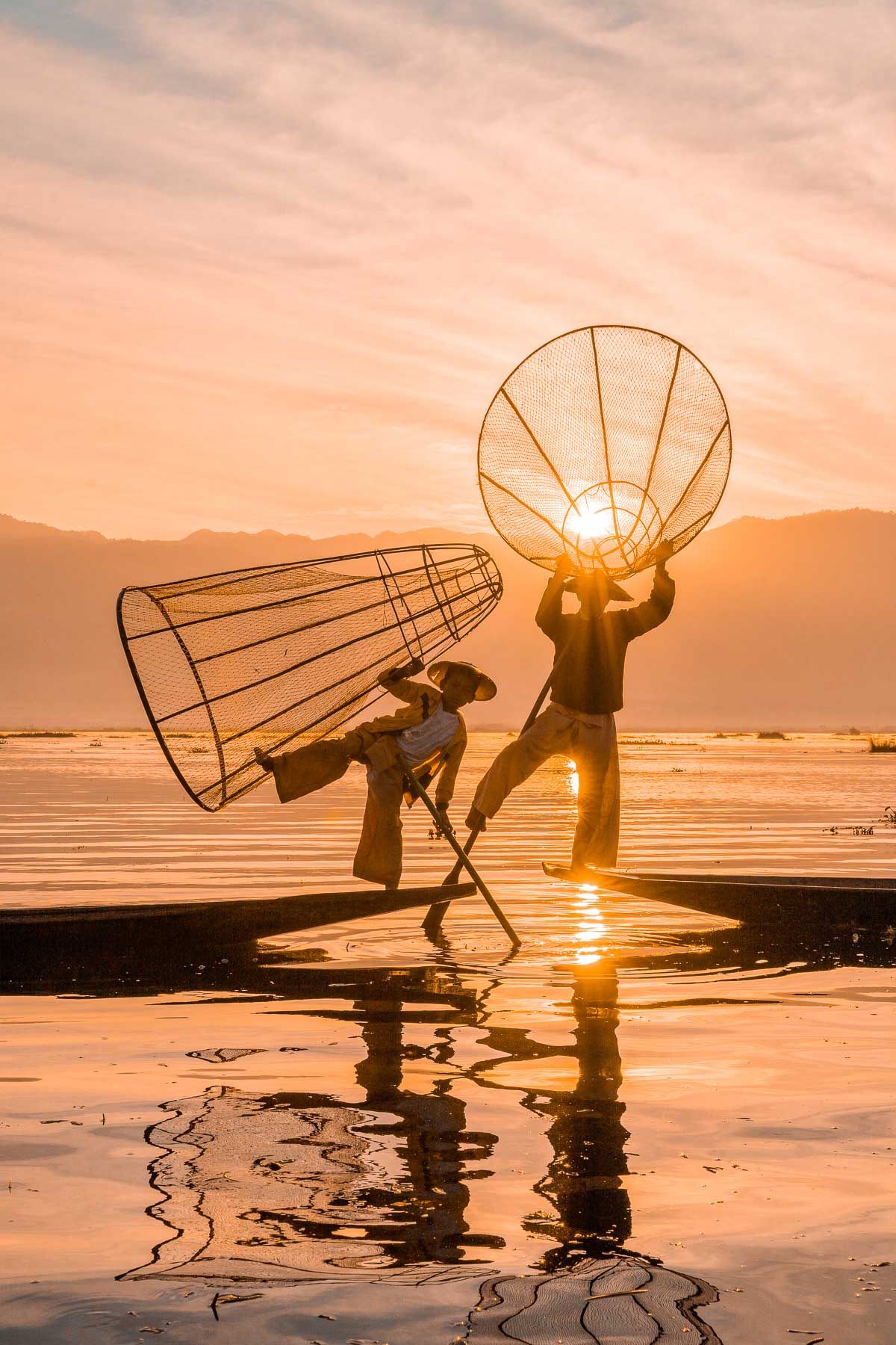 Fishermen on Inle Lake at sunrise