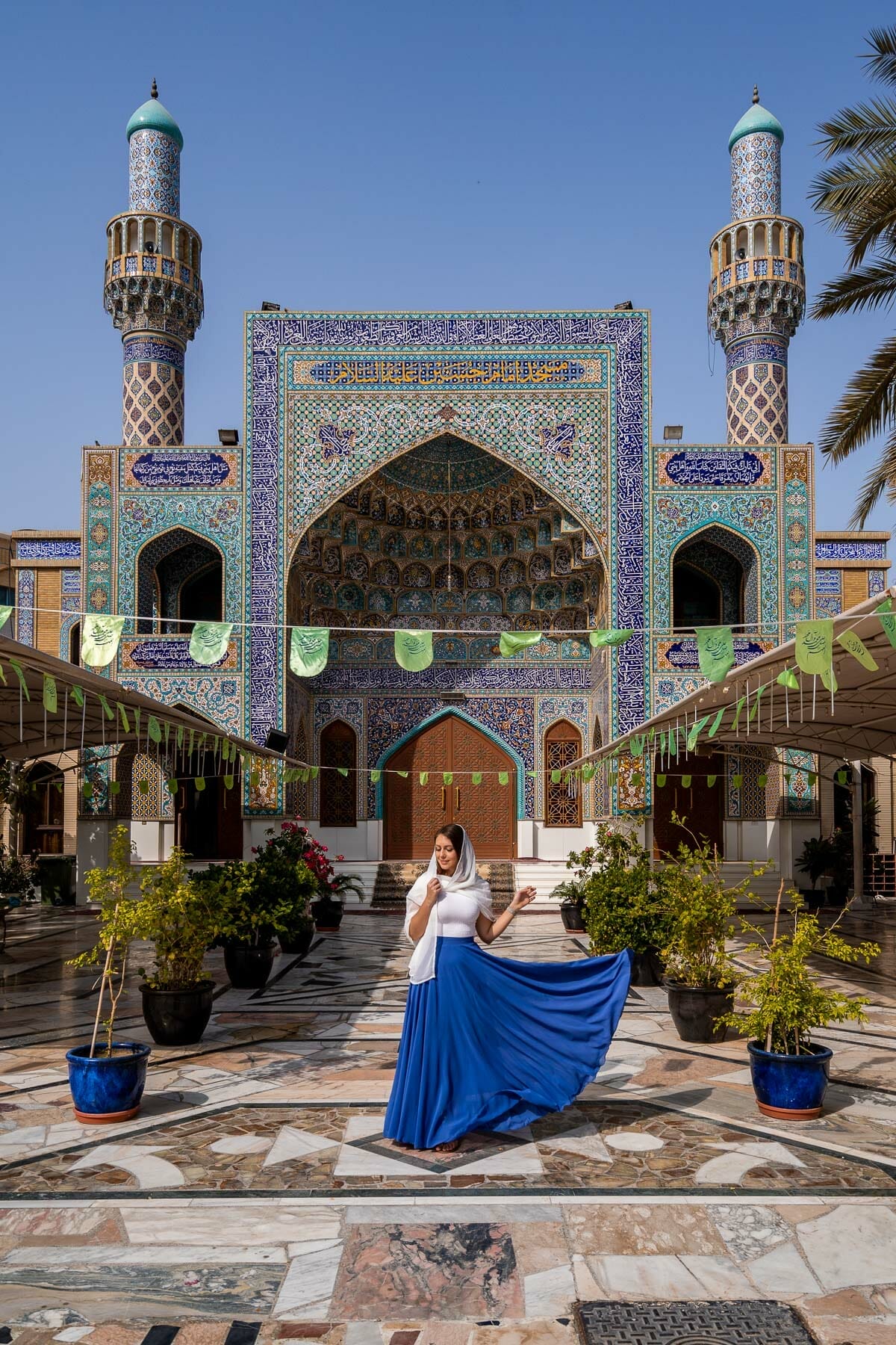 Girl in blue skirt at Imam Hussein Mosque in Dubai