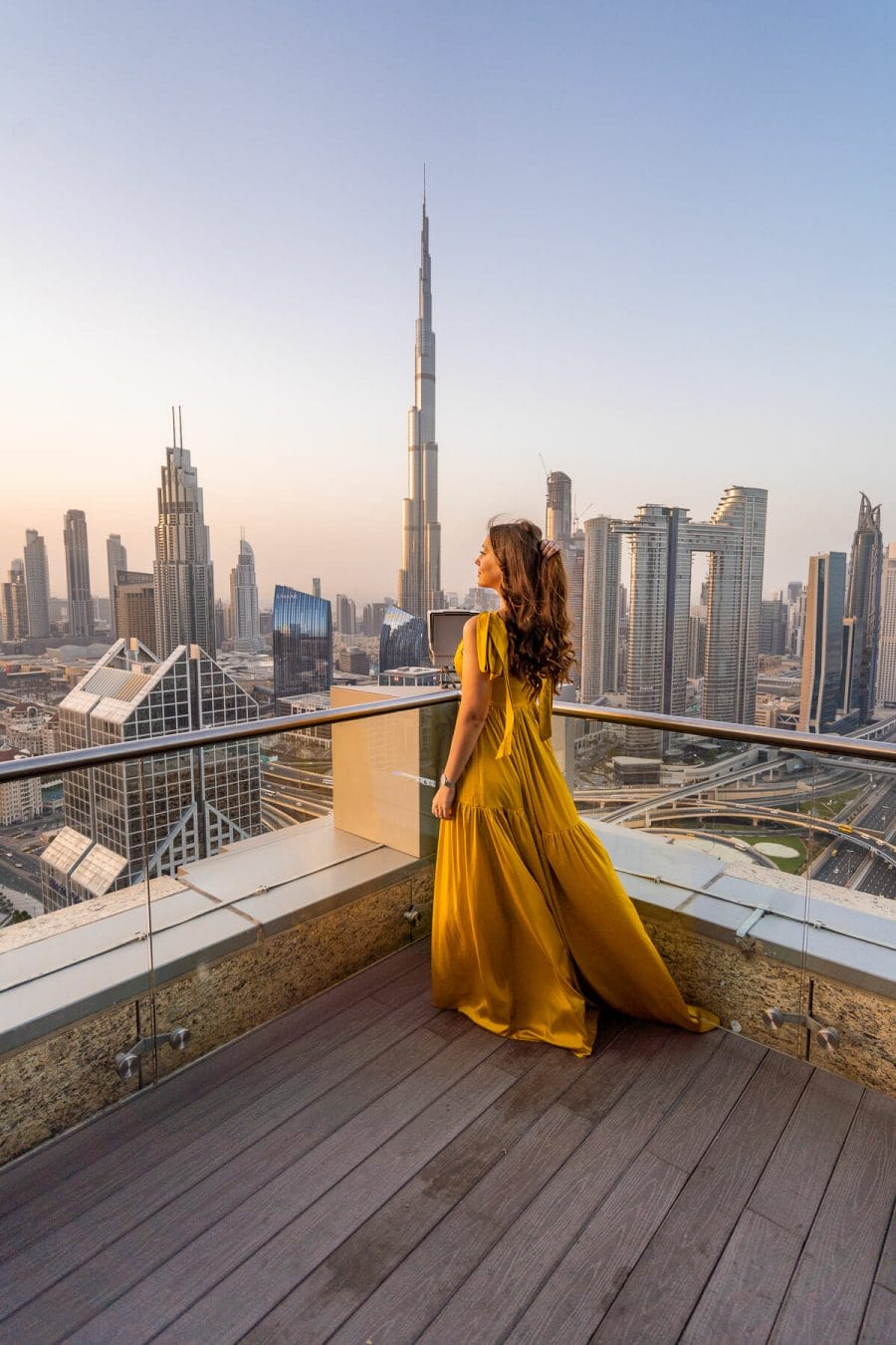 Girl in yellow dress on the terrace at Shangri-La Dubai, one of the most Instagrammable places in Dubai