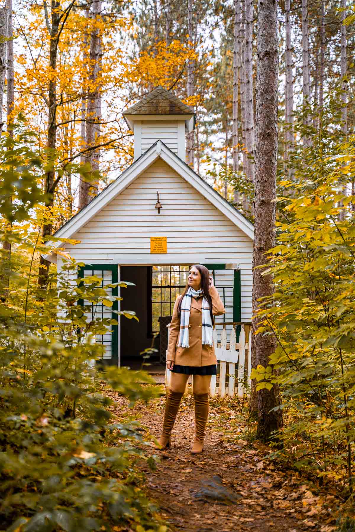 Girl in front of a chapel at Sugarbush Farm, Vermont