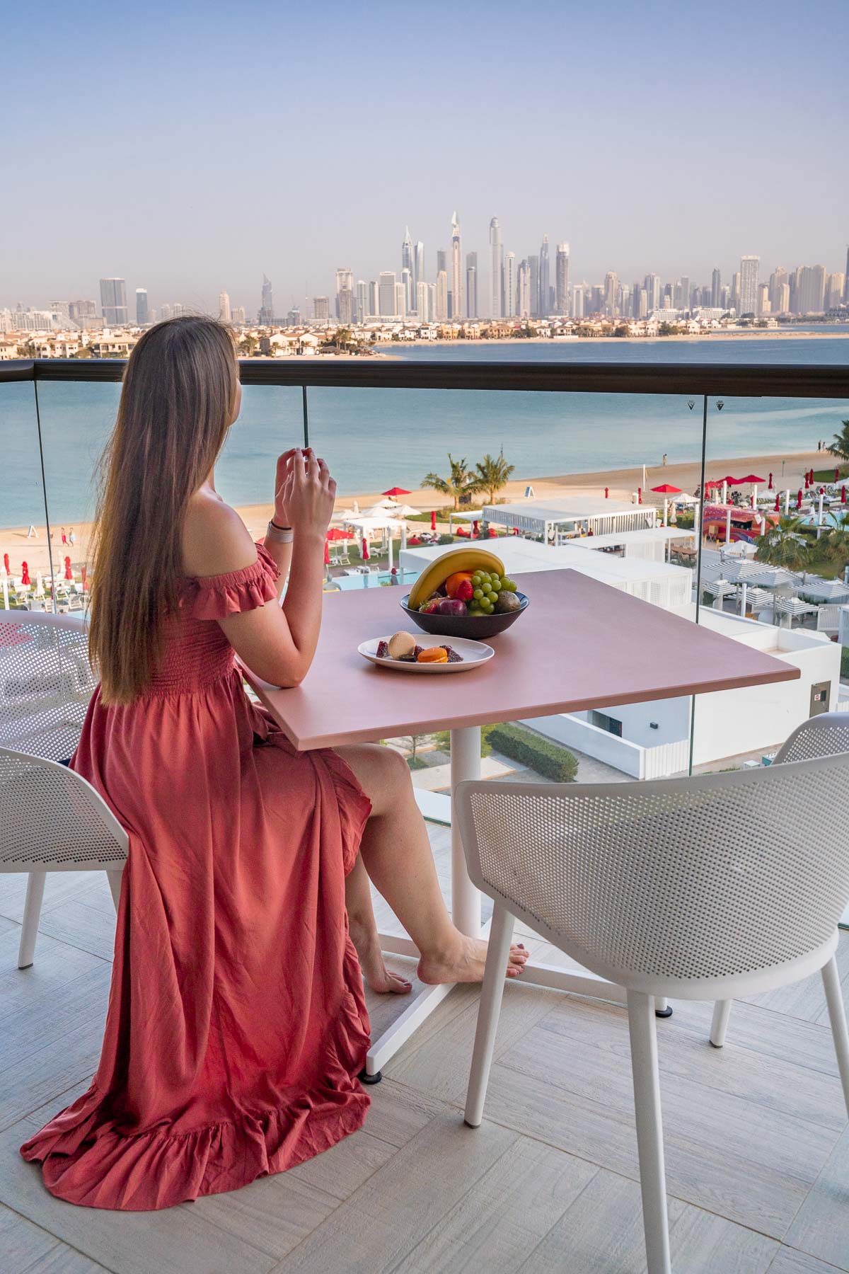 Girl sitting on the terrace at Th8 Palm Dubai