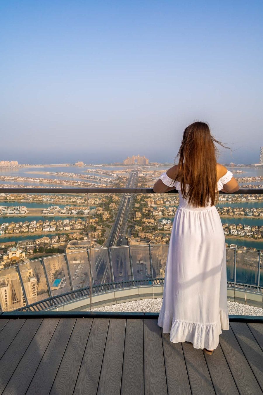 Girl in white dress at The View at The Palm overlooking Palm Jumeirah
