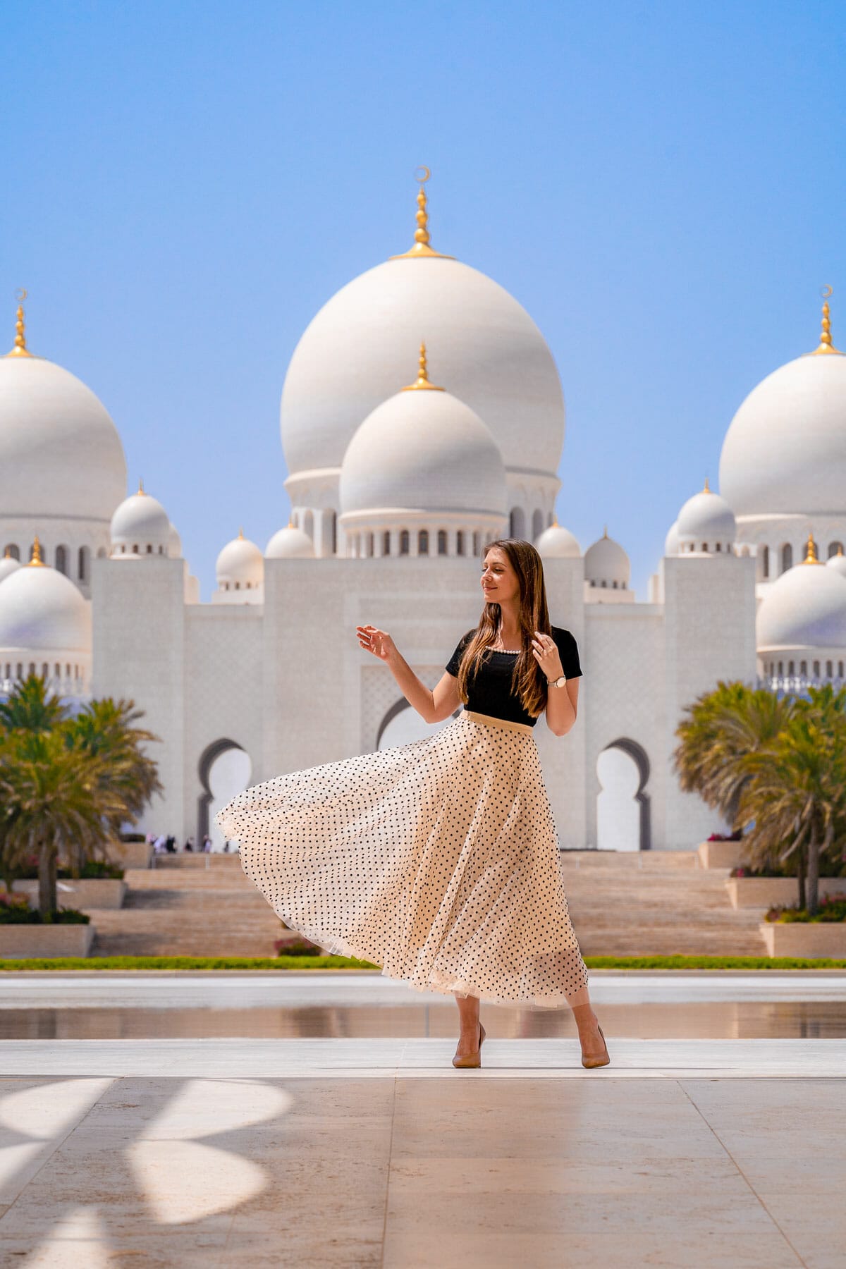 Girl at Wahat al Karama overlooking the Grand Mosque in Abu Dhabi