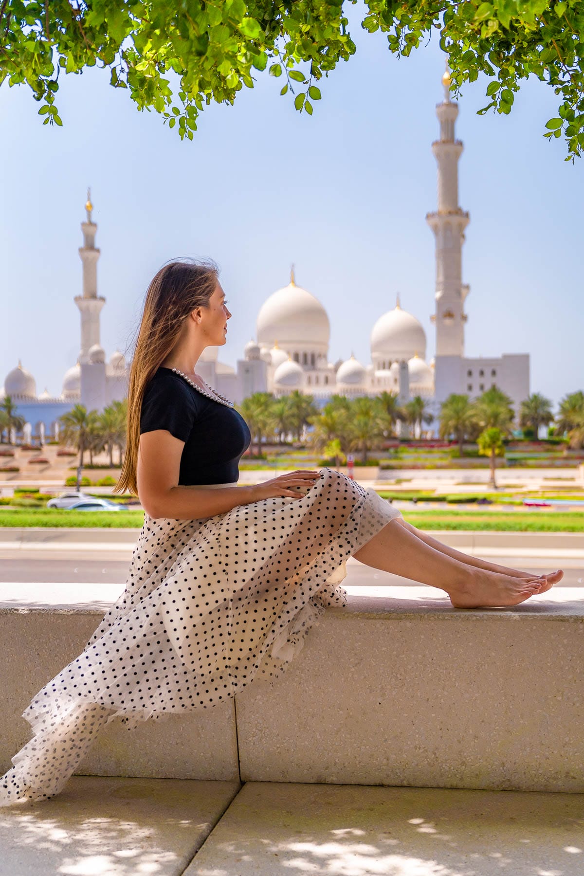 Girl at Wahat al Karama overlooking the Grand Mosque in Abu Dhabi