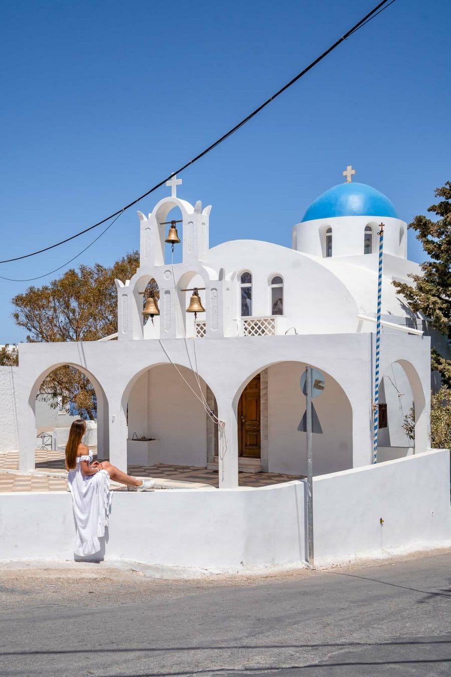 Girl in white dress at Eglise Church, Imerovigli