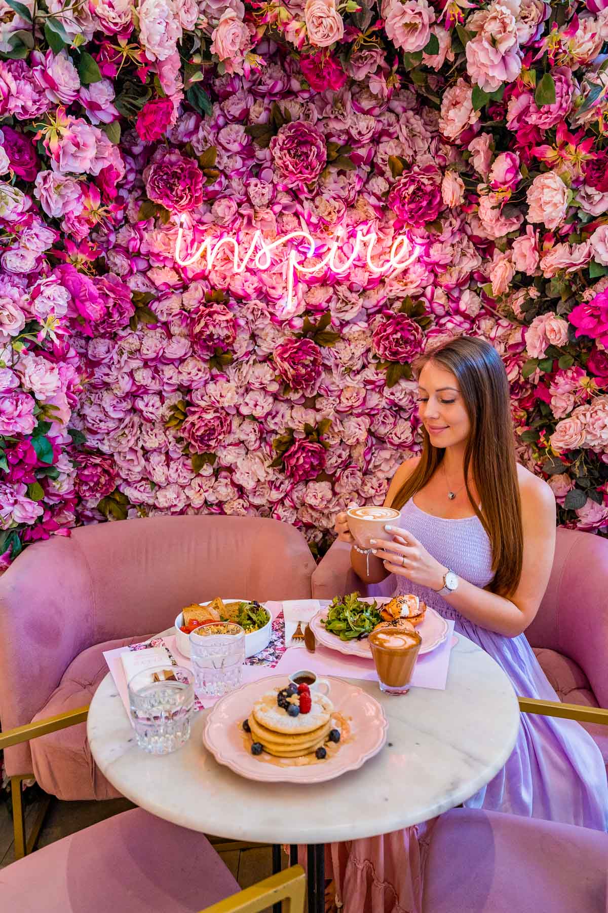 Girl having breakfast at Ellyz Cafe, one of the most Instagrammable places in Athens