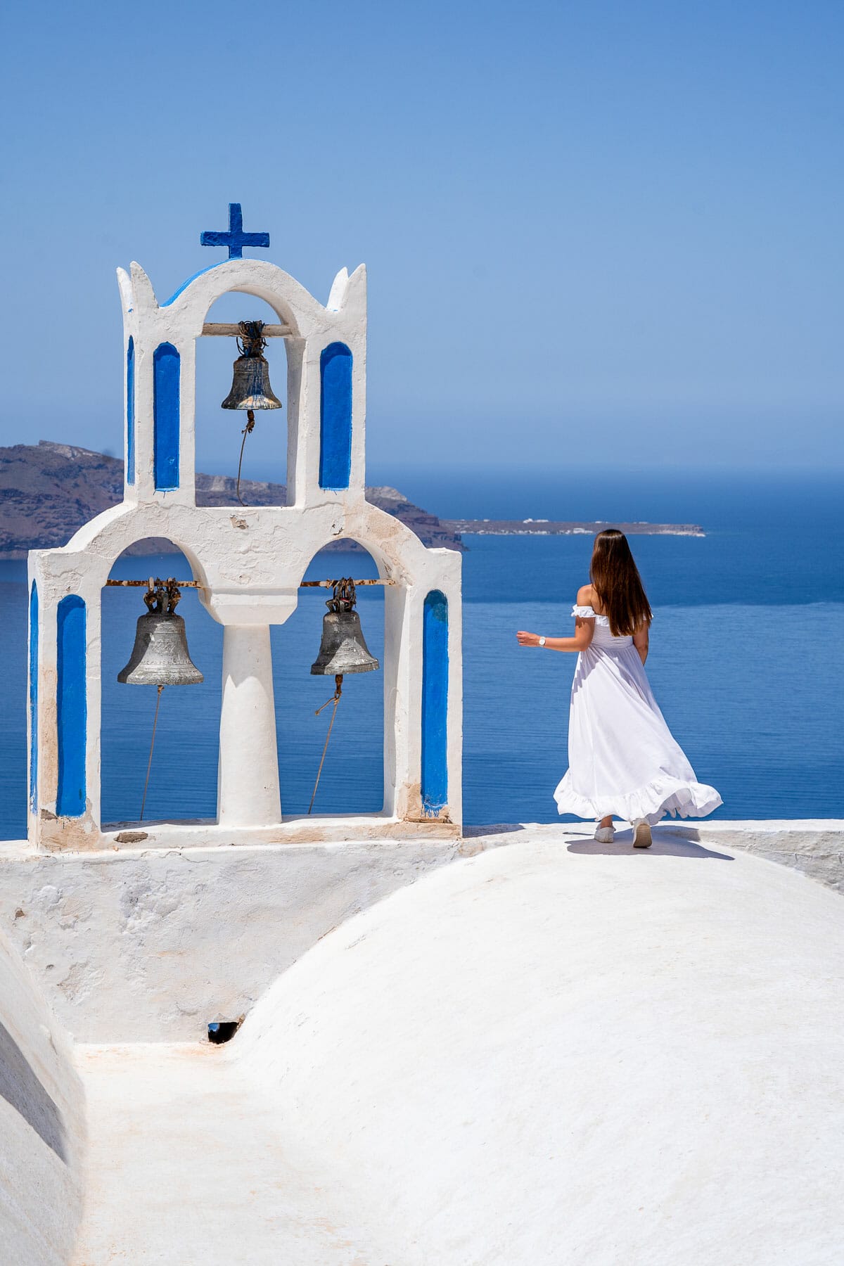 Girl in white dress at Mother of Lord Theoskepasti Holy Orthodox Church, Imerovigli
