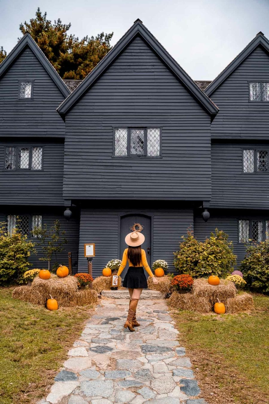 Girl in front of the The Witch House at Salem