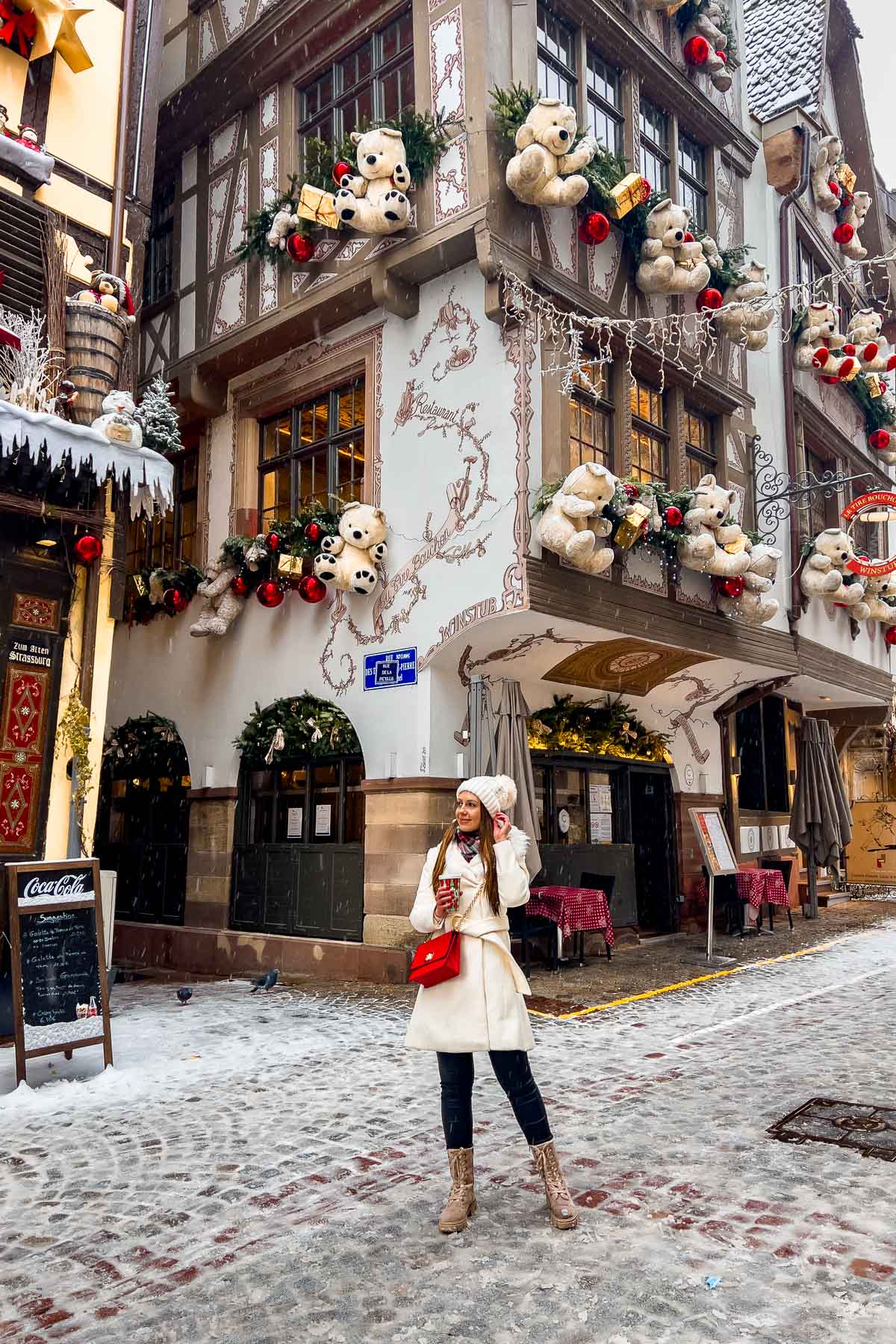 Girl in front of the Teddy bear house in Strasbourg in Christmas
