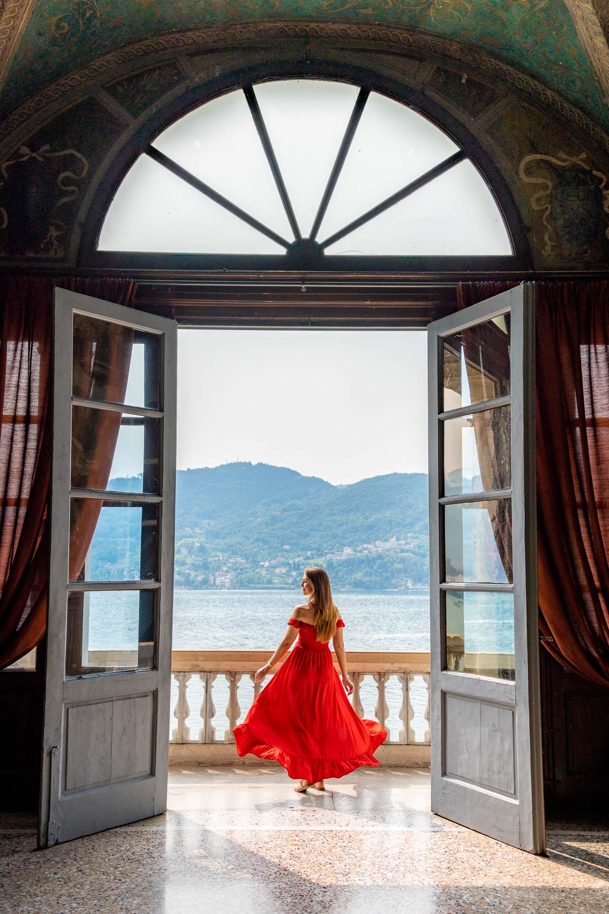 Girl in red dress on the balcony at Villa Carlotta, Lake Como