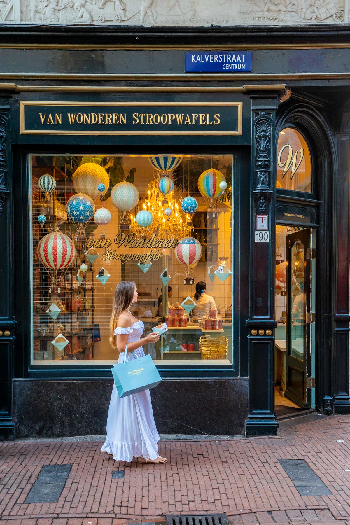 Girl in white dress at Van Wonderen Stroopwafels Amsterdam
